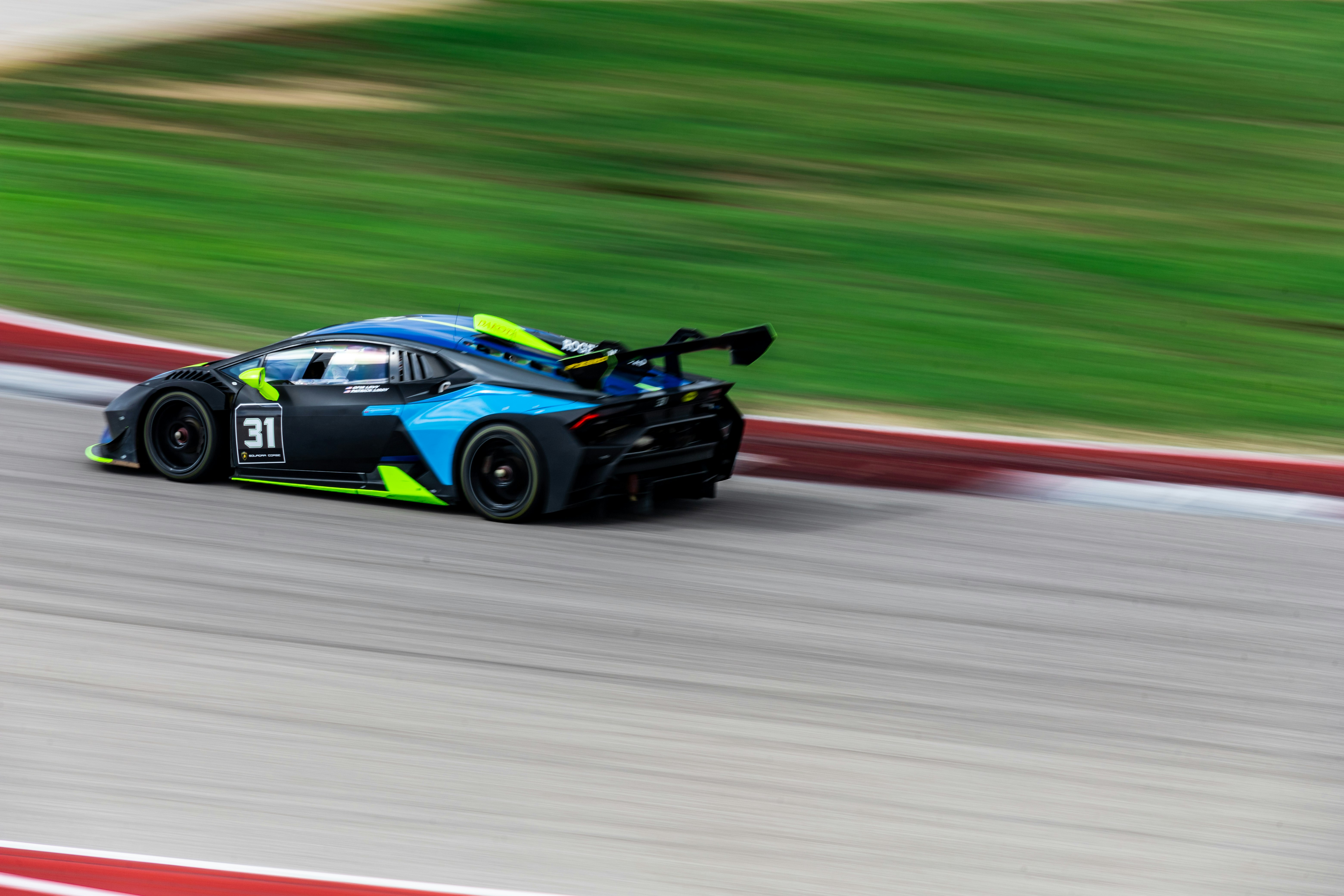 blue and black race car on track